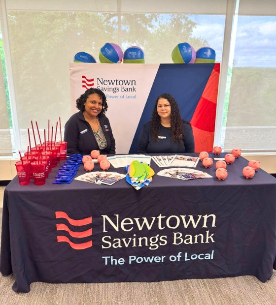 2 employees at financial education table