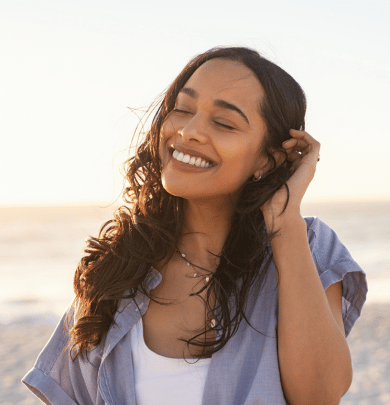 Women smiling at the beach