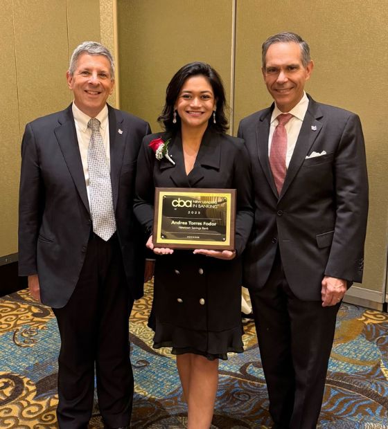 employee with award and the Bank's CEO and chief banking officer