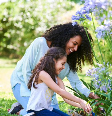 Woman and daughter with spring flowers