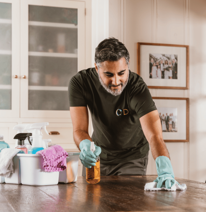 Man cleaning table