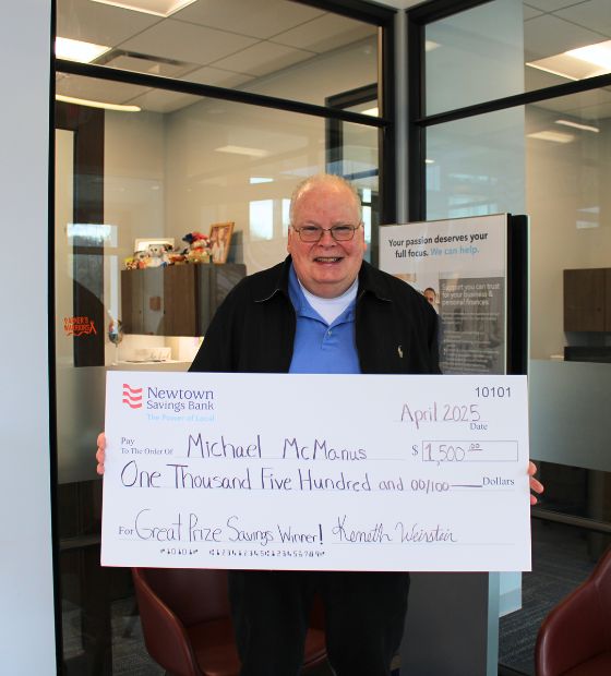 Winner holding big check