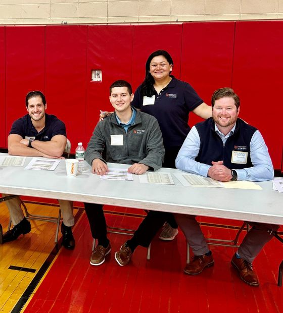 Employees at check-in table